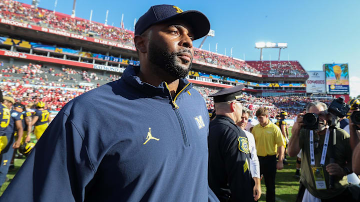 Dec 31, 2024; Tampa, FL, USA; Michigan Wolverines head coach Sherrone Moore celebrates after beating the Alabama Crimson Tide in the ReliaQuest Bowl at Raymond James Stadium. Mandatory Credit: Nathan Ray Seebeck-Imagn Images