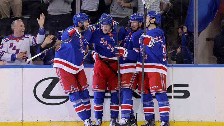 Oct 13, 2026; New York, New York, USA; New York Rangers left wing Alexis Lafreniere (13) celebrates his second goal of the period against the Tampa Bay Lightning with teammates during the first period at Madison Square Garden. Mandatory Credit: Brad Penner-Imagn Images
