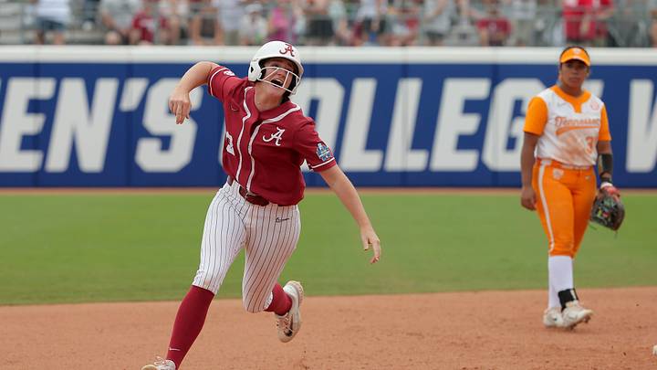 Alabama's Marlie Giles (13) celebrates after hitting a home run in the sixth inning of a softball