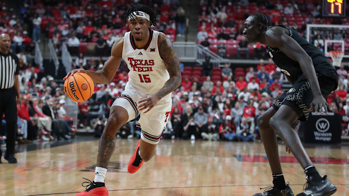 Feb 11, 2026; Lubbock, Texas, USA;  Texas Tech Red Raiders forward JT Toppin (15) works the ball against Colorado Buffaloes forward Bangot Dak (8) in the first half at United Supermarkets Arena. Mandatory Credit: Michael C. Johnson-Imagn Images