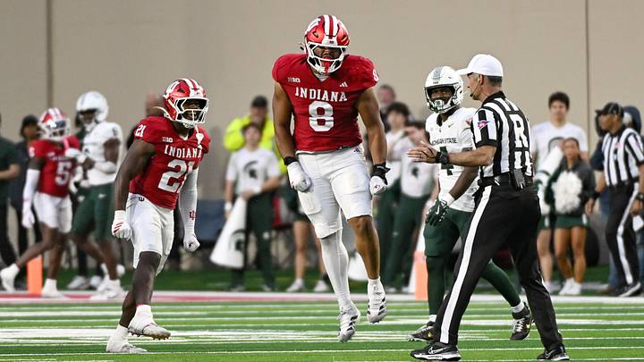 Oct 18, 2025; Bloomington, Indiana, USA; Indiana Hoosiers linebacker Rolijah Hardy (21) and defensive lineman Stephen Daley (8) celebrate after a defensive play during the second half against the Michigan State Spartans at Memorial Stadium. Mandatory Credit: Robert Goddin-Imagn Images