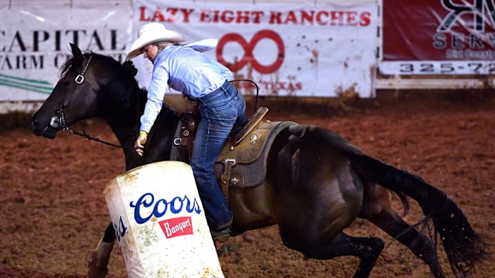 Jacee Spann of Claude tips the barrel during Barrel Racing but instead of falling over it righted itself, saving her from a penalty during Stamford’s Texas Cowboy Reunion Wednesday July 2, 2025.
