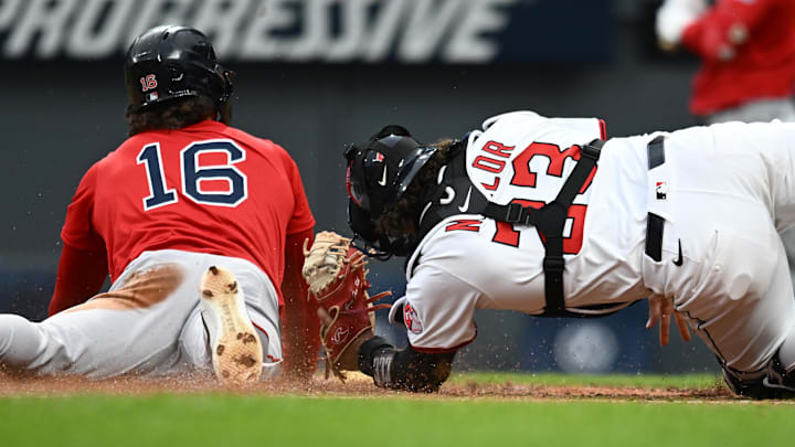 Cleveland, OH, USA; Boston Red Sox left fielder Jarren Duran (16) steals home under the tag of Cleveland Guardians catcher Bo Naylor (23) during the third inning at Progressive Field.