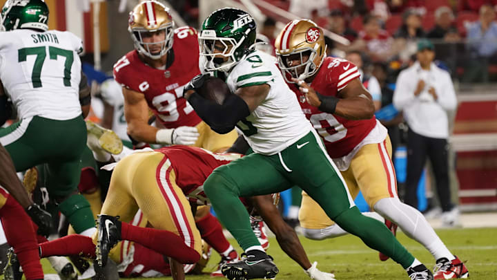 Sep 9, 2024; Santa Clara, California, USA; New York Jets running back Braelon Allen (0) rushes the ball and eludes San Francisco 49ers safety George Odum (30) in the fourth quarter at Levi's Stadium. 