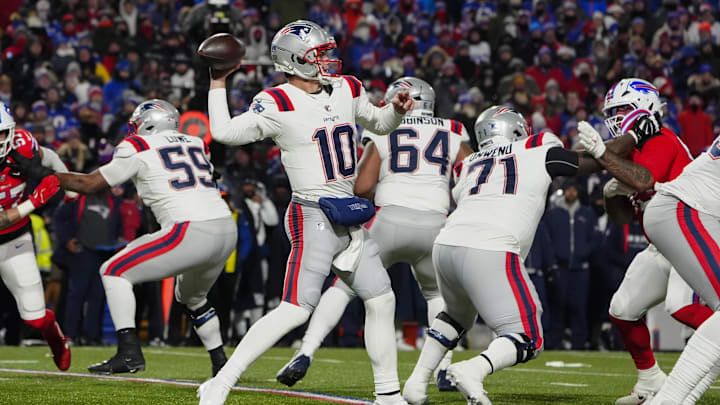Dec 22, 2024; Orchard Park, New York, USA; New England Patriots quarterack Drake Maye (10) throws the ball during the first half at Highmark Stadium.