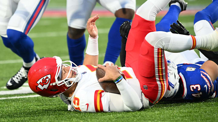 Nov 17, 2024; Orchard Park, New York, USA; Kansas City Chiefs quarterback Patrick Mahomes (15) is sacked by Buffalo Bills linebacker Terrel Bernard (43) in the first quarter at Highmark Stadium. Mandatory Credit: Mark Konezny-Imagn Images