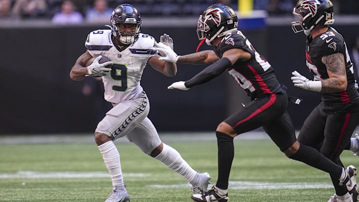 Oct 20, 2024; Atlanta, Georgia, USA; Seattle Seahawks running back Kenneth Walker III (9) runs against Atlanta Falcons cornerback A.J. Terrell (24) during the first quarter at Mercedes-Benz Stadium. Mandatory Credit: Dale Zanine-Imagn Images