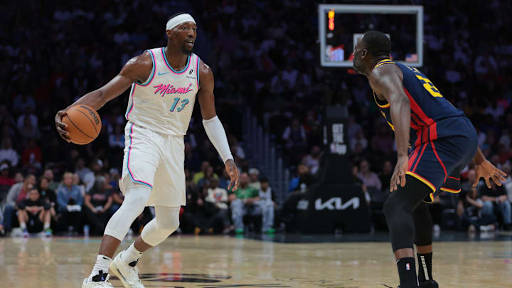 Mar 25, 2025; Miami, Florida, USA; Miami Heat center Bam Adebayo (13) dribbles the basketball as Golden State Warriors forward Draymond Green (23) defends during the third quarter at Kaseya Center. Mandatory Credit: Sam Navarro-Imagn Images Mar 25, 2025; Miami, Florida, USA; Miami Heat center Bam Adebayo (13) dribbles the basketball as Golden State Warriors forward Draymond Green (23) defends during the third quarter at Kaseya Center. Mandatory Credit: Sam Navarro-Imagn Images