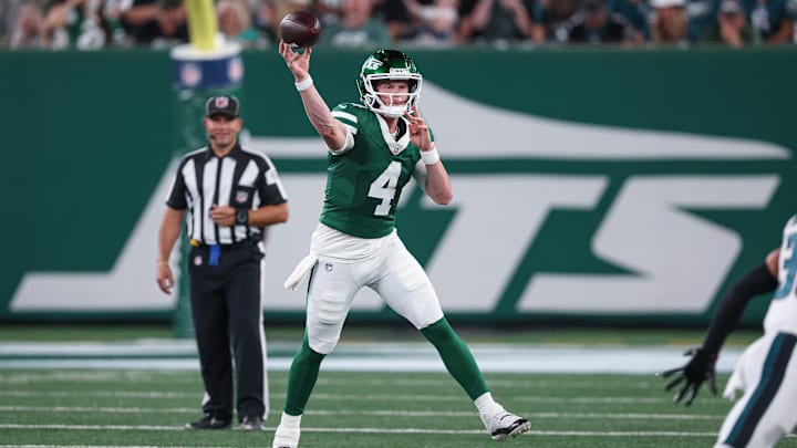 Aug 22, 2025; East Rutherford, New Jersey, USA; New York Jets quarterback Brady Cook (4) throws a pass during the first half against the Philadelphia Eagles at MetLife Stadium. Mandatory Credit: Vincent Carchietta-Imagn Images