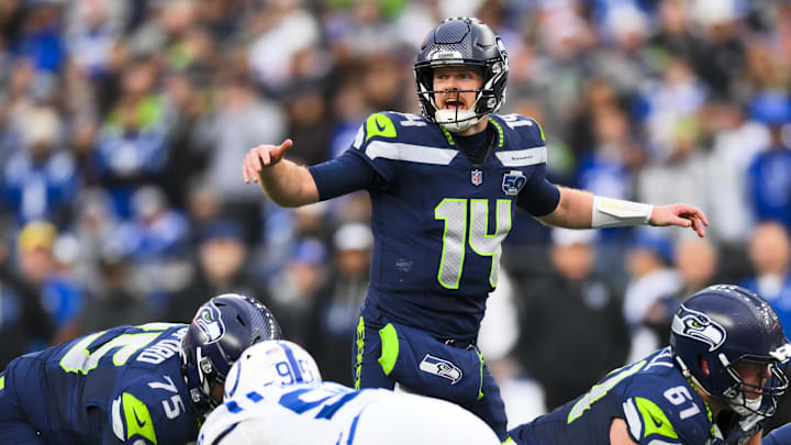 Dec 14, 2025; Seattle, Washington, USA; Seattle Seahawks quarterback Sam Darnold (14) audibles over center against the Indianapolis Colts during the third quarter at Lumen Field.