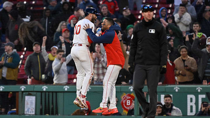 Apr 10, 2025; Boston, Massachusetts, USA; Boston Red Sox shortstop Trevor Story (10) celebrates his game winning RBI against the Toronto Blue Jays with catcher Carlos Narvaez (75) during the tenth inning at Fenway Park. Mandatory Credit: Eric Canha-Imagn Images
