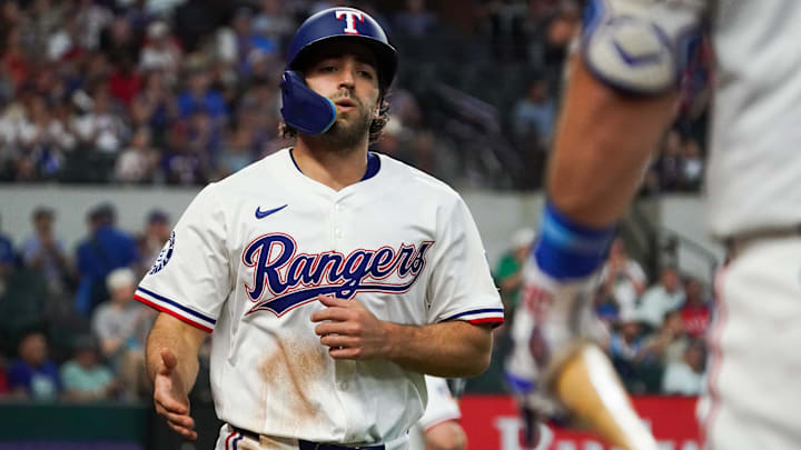 Texas Rangers shortstop Josh Smith (8) heads the for the dugout after scoring during the first inning against the Arizona Diamondbacks at Globe Life Field. Texas Rangers shortstop Josh Smith (8) heads the for the dugout after scoring during the first inning against the Arizona Diamondbacks at Globe Life Field.