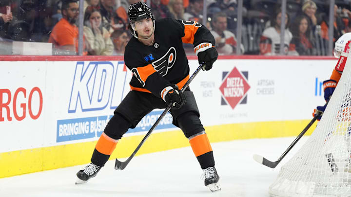Apr 12, 2025; Philadelphia, Pennsylvania, USA; Philadelphia Flyers defenseman Jamie Drysdale (9) passes the puck against the New York Islanders in the first period at Wells Fargo Center.