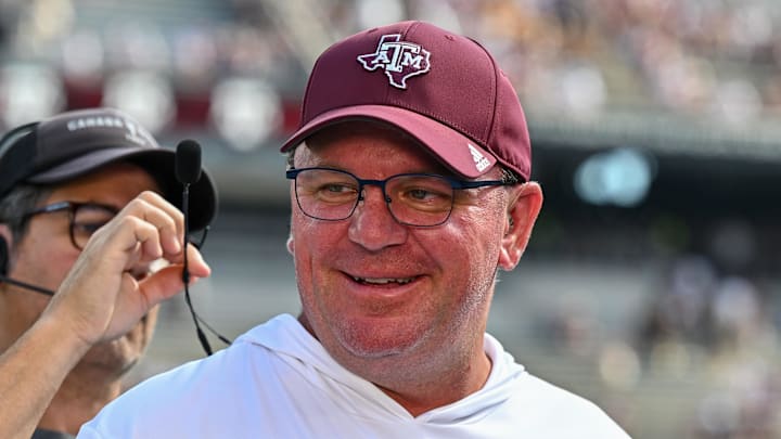 Oct 5, 2024; College Station, Texas, USA; Texas A&M Aggies head coach Mike Elko gets ready for a pre-game interview with the SEC Nation prior to the game against the Missouri Tigers at Kyle Field. Mandatory Credit: Maria Lysaker-Imagn Images. 
