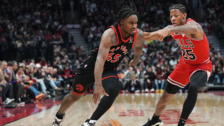 Jan 31, 2025; Toronto, Ontario, CAN; Toronto Raptors guard Davion Mitchell (45) controls the ball as Chicago Bulls forward Dalen Terry (25) tries to defend during the second quarter at Scotiabank Arena. Mandatory Credit: Nick Turchiaro-Imagn Images Jan 31, 2025; Toronto, Ontario, CAN; Toronto Raptors guard Davion Mitchell (45) controls the ball as Chicago Bulls forward Dalen Terry (25) tries to defend during the second quarter at Scotiabank Arena. Mandatory Credit: Nick Turchiaro-Imagn Images