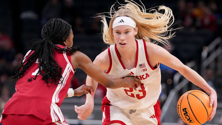 Nebraska Cornhuskers guard Britt Prince pushes past Indiana Hoosiers guard Jerni Kiaku. Nebraska Cornhuskers guard Britt Prince pushes past Indiana Hoosiers guard Jerni Kiaku.