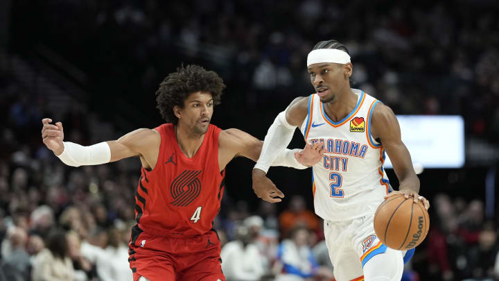 Mar 6, 2024; Portland, Oregon, USA; Oklahoma City Thunder point guard Shai Gilgeous-Alexander (2) dribbles the ball while defended by  Portland Trail Blazers shooting guard Matisse Thybulle (4) during the second half at Moda Center. Mandatory Credit: Soobum Im-USA TODAY Sports