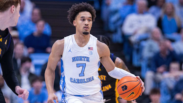 Dec 22, 2025; Chapel Hill, North Carolina, USA; North Carolina Tar Heels guard Seth Trimble (7) brings the ball up court against the East Carolina Pirates during the second half at Dean E. Smith Center. Mandatory Credit: Scott Kinser-Imagn Images