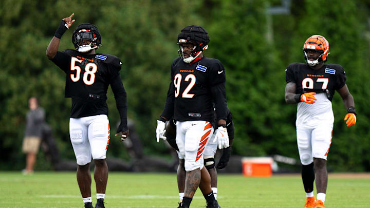 Cincinnati Bengals defensive end Joseph Ossai (58) and Cincinnati Bengals defensive tackle B.J. Hill (92) walk together during Cincinnati Bengals Practice in Cincinnati on Aug. 21, 2025.