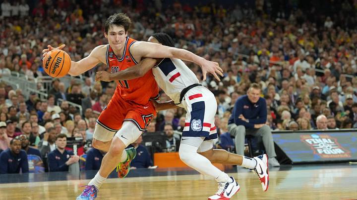 Apr 4, 2026; Indianapolis, IN, USA; Illinois Fighting Illini forward David Mirkovic (0) is fouled by Connecticut Huskies guard Silas Demary Jr. (2) in the second half during a semifinal of the Final Four of the men's 2026 NCAA Tournament at Lucas Oil Stadium. Mandatory Credit: Robert Deutsch-Imagn Images Apr 4, 2026; Indianapolis, IN, USA; Illinois Fighting Illini forward David Mirkovic (0) is fouled by Connecticut Huskies guard Silas Demary Jr. (2) in the second half during a semifinal of the Final Four of the men's 2026 NCAA Tournament at Lucas Oil Stadium. Mandatory Credit: Robert Deutsch-Imagn Images