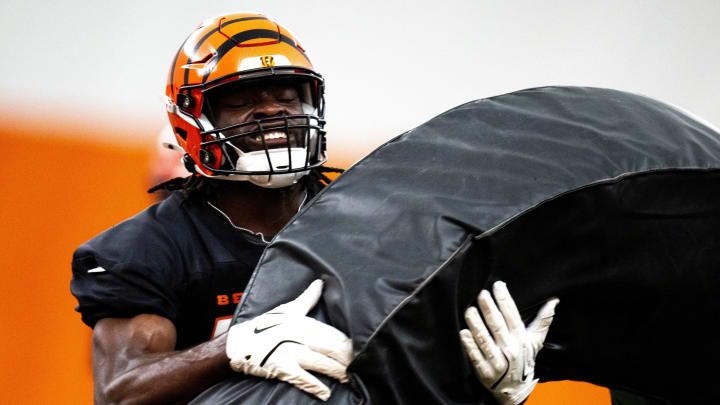 Cincinnati Bengals linebacker Maema Njongmeta (45) hits a pad during a drill at Bengals spring practice at the IEL Indoor Facility in Cincinnati on Tuesday, June 11, 2024. Cincinnati Bengals linebacker Maema Njongmeta (45) hits a pad during a drill at Bengals spring practice at the IEL Indoor Facility in Cincinnati on Tuesday, June 11, 2024.