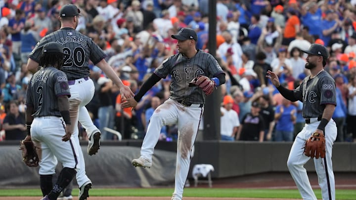 Sep 21, 2024; New York City, New York, USA; New York Mets first baseman Pete Alonso (20) and New York Mets second baseman Jose Iglesias (11) high five after the game against the Philadelphia Phillies at Citi Field. Mandatory Credit: Lucas Boland-Imagn Images