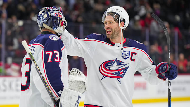 Blue Jackets goaltender Jet Greaves celebrates his win over Ottawa with captain Boone Jenner. 