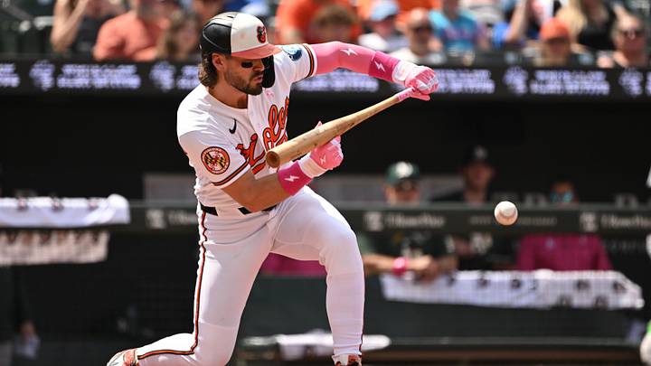 May 10, 2026; Baltimore, Maryland, USA; Baltimore Orioles third baseman Blaze Alexander (23) bunts the ball into play against the Athletics during the third inning at Oriole Park at Camden Yards. Mandatory Credit: Rafael Suanes-Imagn Images