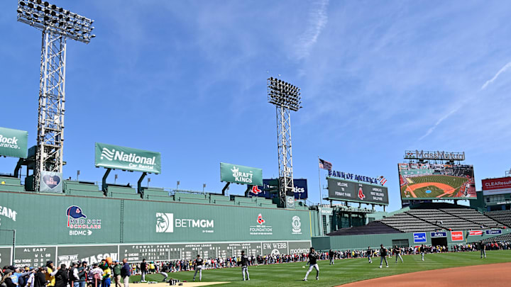 Apr 20, 2025; Boston, Massachusetts, USA; Fans line the field in front of the Green Monster as the Chicago White Sox warm up before a game at Fenway Park. Mandatory Credit: Eric Canha-Imagn Images