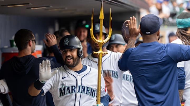Aug 27, 2025; Seattle, Washington, USA; Seattle Mariners third baseman Eugenio Suarez (28) celebrates in the dugout after hitting a three-run home run during the fourth inning against the San Diego Padres at T-Mobile Park. Mandatory Credit: Stephen Brashear-Imagn Images