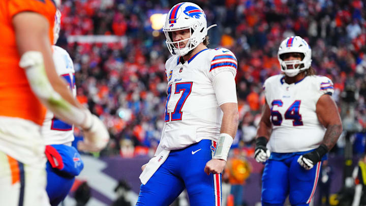 Buffalo Bills quarterback Josh Allen (17) celebrates after a touchdown against the Denver Broncos during the fourth quarter of an AFC Divisional Round playoff game at Empower Field at Mile High.