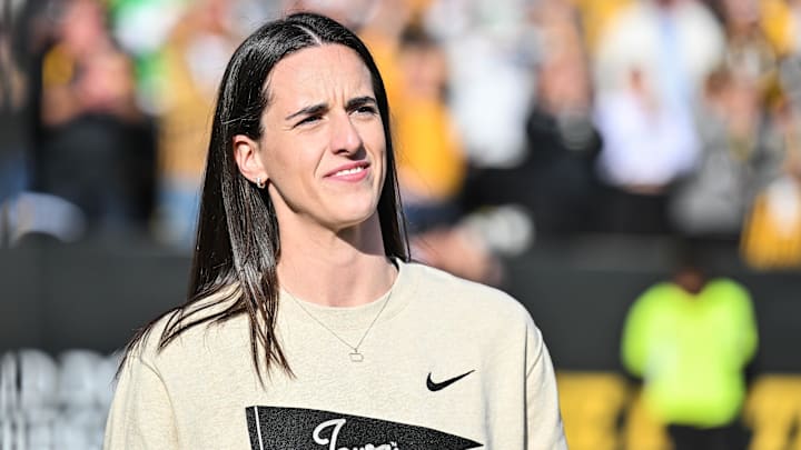 Oct 26, 2024; Iowa City, Iowa, USA; Former Iowa Hawkeye and current Indiana Fever WNBA star Caitlin Clark looks on while being honored during the game between the Iowa Hawkeyes and the Northwestern Wildcats at Kinnick Stadium. Mandatory Credit: Jeffrey Becker-Imagn Images