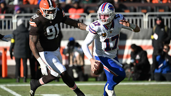 Dec 21, 2025; Cleveland, Ohio, USA;  Buffalo Bills quarterback Josh Allen (17) is pressured by Cleveland Browns defensive end Alex Wright (91) during the first half at Huntington Bank Field.