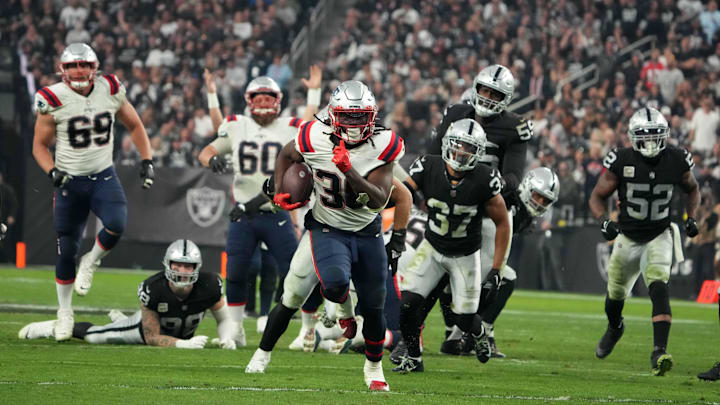 Dec 18, 2022; Paradise, Nevada, USA; New England Patriots running back Rhamondre Stevenson (38) scores on a 34-yard touchdown run in the second half against the Las Vegas Raiders at Allegiant Stadium. The Raiders defeated the Patriots 30-24. Mandatory Credit: Kirby Lee-USA TODAY Sports