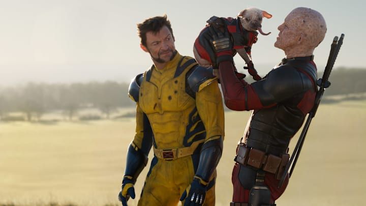 (L-R): Hugh Jackman as Wolverine/Logan, Dogpool, and Ryan Reynolds as Deadpool/Wade Wilson in 20th Century Studios/Marvel Studios' DEADPOOL & WOLVERINE. Photo by Jay Maidment. © 2024 20th Century Studios / © and ™ 2024 MARVEL.