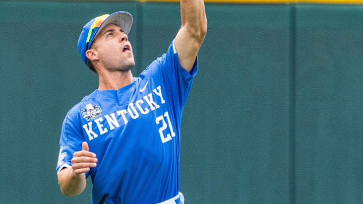 Jun 15, 2024; Omaha, NE, USA; Kentucky Wildcats left fielder Ryan Waldschmidt (21) catches a fly-ball for an out against the NC State Wolfpack during the first inning at Charles Schwab Filed Omaha. Mandatory Credit: Dylan Widger-Imagn Images