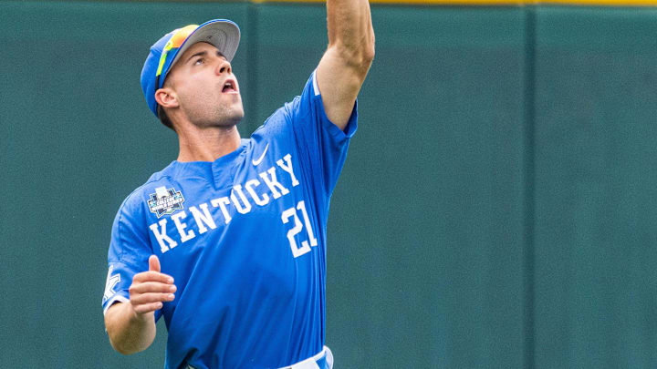 Jun 15, 2024; Omaha, NE, USA; Kentucky Wildcats left fielder Ryan Waldschmidt (21) catches a fly-ball for an out against the NC State Wolfpack during the first inning at Charles Schwab Filed Omaha. Mandatory Credit: Dylan Widger-Imagn Images