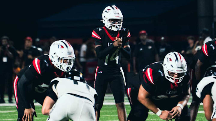 Chaminade-Madonna quarterback Malik Leonard (14) will lead the Lions into their 10th consecutive state championship game on Wednesday, Dec. 11, when they play Cardinal Newman for the Class 1A title at FIU in Miami. Chaminade-Madonna has won the last four state championships.
