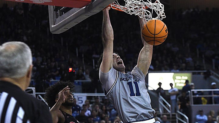 Nevada 's Nick Davidson dunks against UNLV March 9, 2024. 
