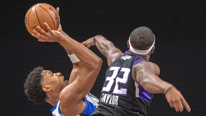 Osceola Magic’s Myron Gardner, left, is guarded by Stockton King’s Terry Taylor during game 2 of the NBA G League final against the Osceola Magic at the Adventist Health Arena in downtown Stockton on Apr. 11, 2025. The Kings won 144 to 126.