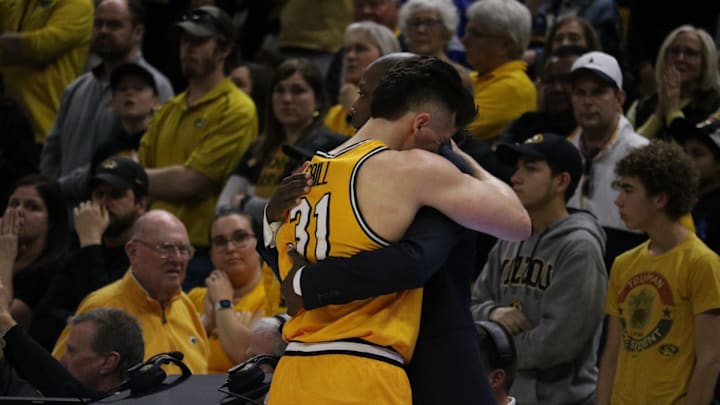 Mar 8, 2025; Columbia, Missouri USA; Missouri Tigers guard Caleb Grill (31) cries in the arms of head coach Dennis Gates during his final game at Mizzou Arena — a loss to the Kentucky Wildcats.