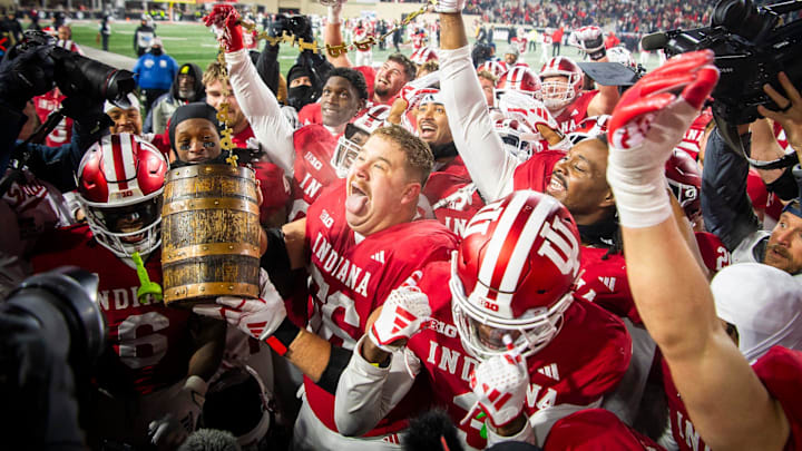 Indiana's Mike Katic (56) and the Hoosiers hoist the Old Oaken Bucket after the Indiana versus Purdue football game at Memorial Stadium on Saturday, Nov. 30, 2024.