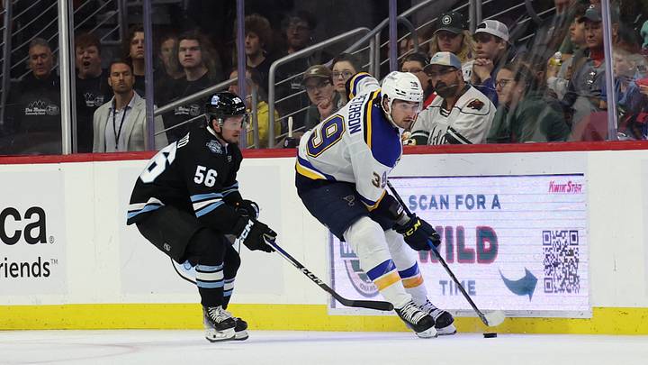 Sep 22, 2024; Des Moines, Iowa, USA;  St. Louis Blues Dylan Peterson (39) skates away from Utah Hockey Club forward Kailer Yamamoto (56) at Wells Fargo Arena. Utah beat St. Louis 5 to 3. Mandatory Credit: Reese Strickland-Imagn Images