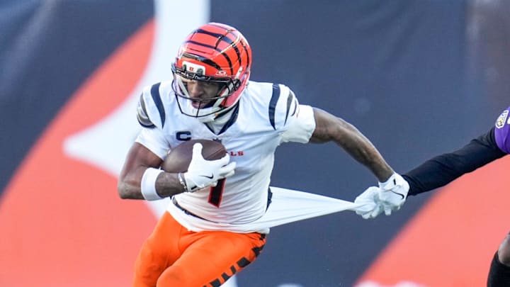 Cincinnati Bengals wide receiver Ja'Marr Chase (1) is pulled on by Baltimore Ravens cornerback Nate Wiggins (2) after a catch in the fourth quarter of the NFL Week 15 game between the Cincinnati Bengals and the Baltimore Ravens at Paycor Stadium in Cincinnati on Sunday, Dec. 14, 2025. The Bengals were shut out, 24-0.