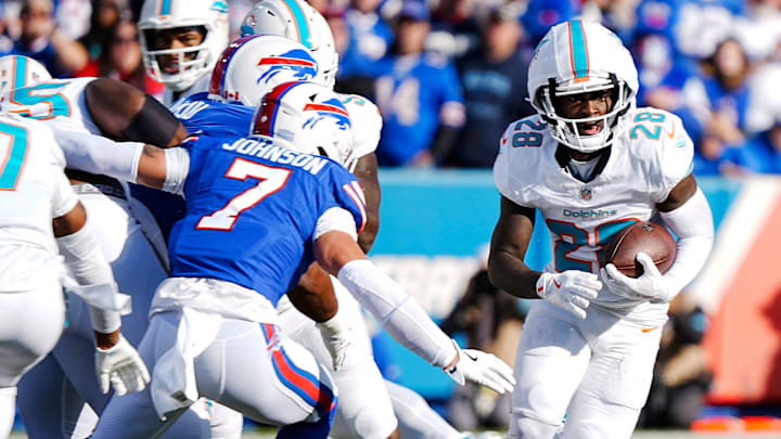 Bills CB Taron Johnson turns and reaches out to grab Miami's De'Von Achane during first half action at Highmark Stadium on Nov. 3, 2024.