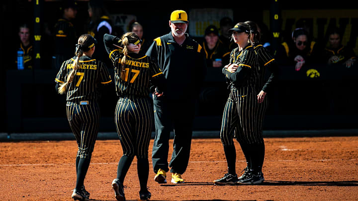 Iowa assistant coach Brian Levin talks with players during an NCAA Big Ten Conference softball game against Nebraska, Tuesday, March 28, 2023, at Bob Pearl Field in Iowa City, Iowa.