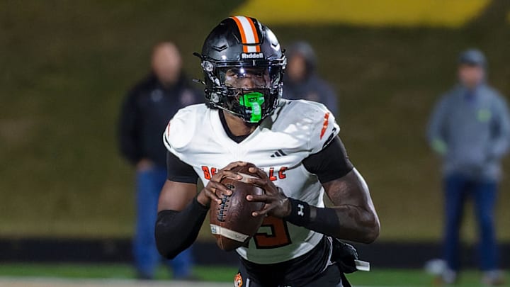 Belleville's Bryce Underwood rolls out to pass during a loss to Howell Friday, Oct. 25, 2024.