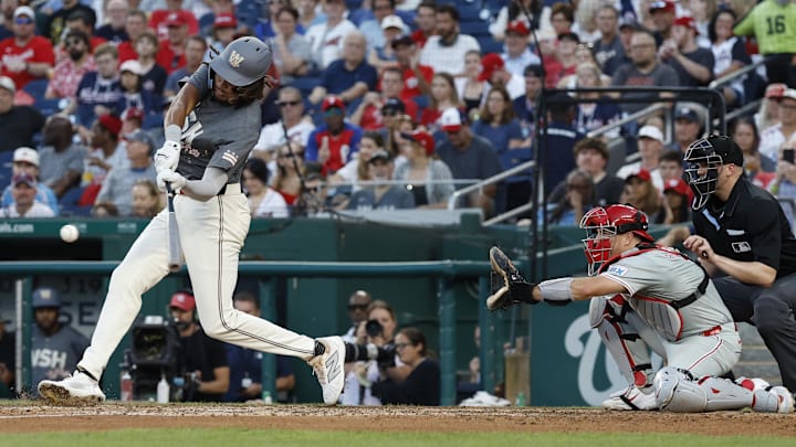 Sep 28, 2024; Washington, District of Columbia, USA; Washington Nationals outfielder James Wood (29) triples against the Philadelphia Phillies during the eighth inning at Nationals Park. 