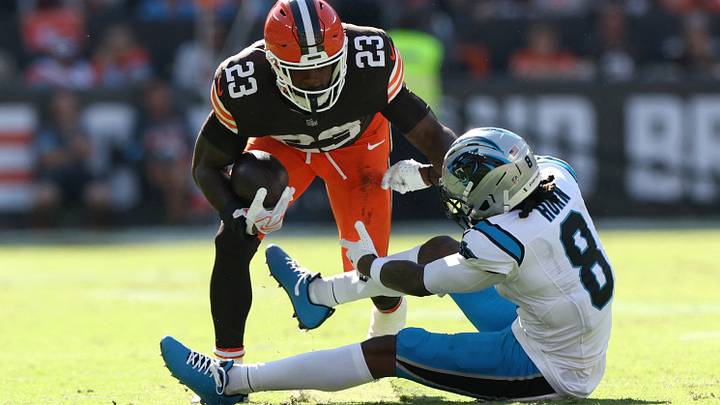 Sep 27, 2026; Cleveland, Ohio, USA;  Cleveland Browns running back Raheim Sanders (23)avoids a tackle by Carolina Panthers cornerback Jaycee Horn (8) during the fourth quarter at Huntington Bank Field.  Mandatory Credit: Scott Galvin-Imagn Images