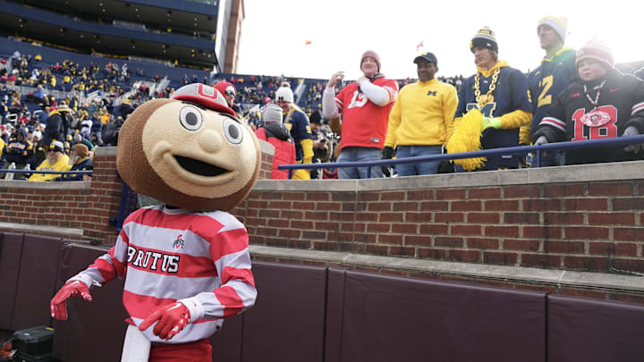 Nov 25, 2023; Ann Arbor, Michigan, USA; Ohio State Buckeyes mascot Brutus Buckeye walks the sideline prior to the NCAA football game against the Michigan Wolverines at Michigan Stadium. Nov 25, 2023; Ann Arbor, Michigan, USA; Ohio State Buckeyes mascot Brutus Buckeye walks the sideline prior to the NCAA football game against the Michigan Wolverines at Michigan Stadium.